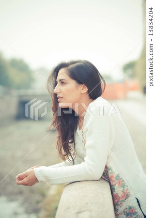 young beautiful brunette woman 13834204