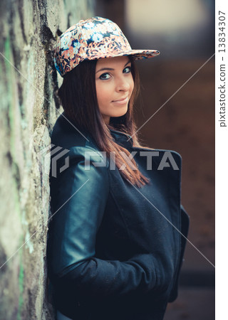 young beautiful brunette straight hair woman in the park 13834307