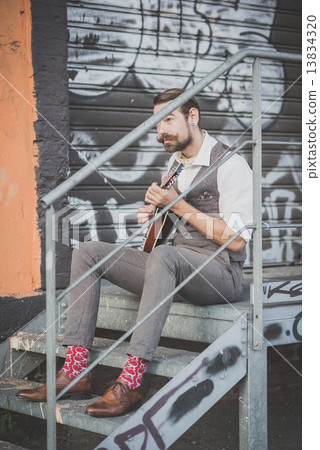 handsome big moustache hipster man playing mandolin handsome big moustache hipster man playing mandolin 13834320