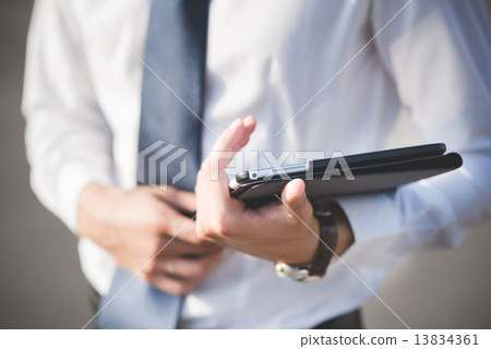 close up businessman man hand using tablet device 13834361