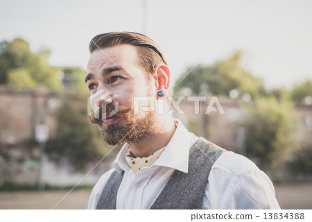 handsome big moustache hipster man smoking cigarette 13834388