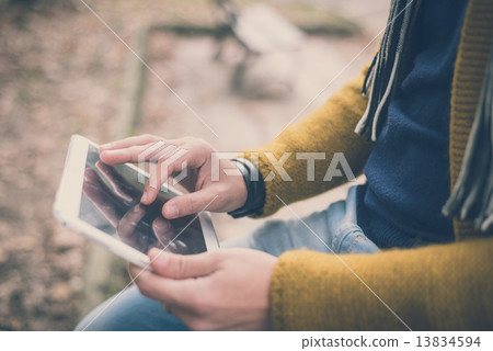 young handsome caucasian man in autumn park 13834594