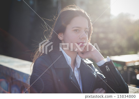 young beautiful long hair woman in town 13834800