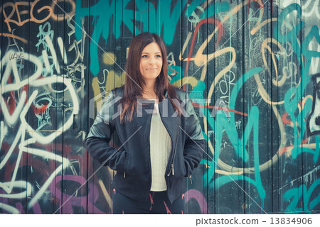 young beautiful brunette straight hair woman in the park 13834906