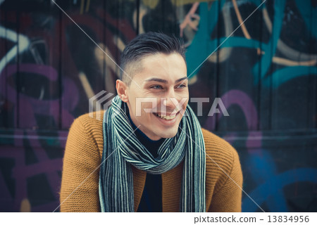 young handsome caucasian man in autumn park young handsome caucasian man in autumn park 13834956