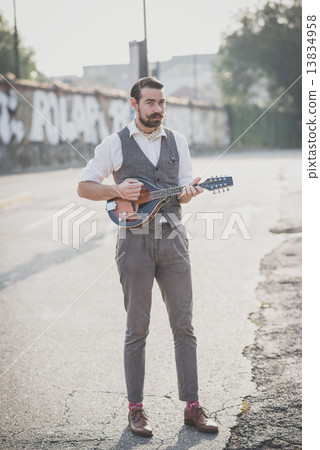 handsome big moustache hipster man playing mandolin 13834958
