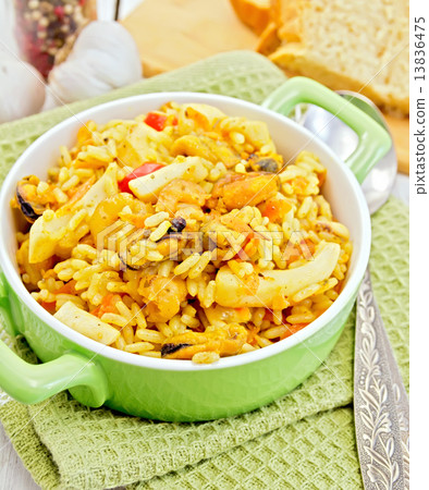 Pilaf with seafood and bread on napkin Pilaf with seafood and bread on napkin 13836475