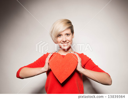 Valentine's Day. Love. Girl holding a heart 13839364