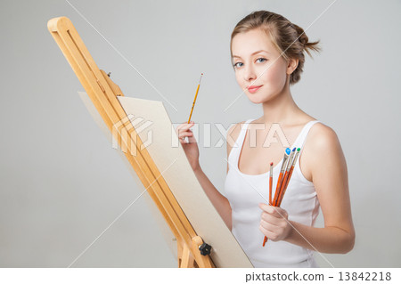 Artist with paintbrushes and canvas over white Artist with paintbrushes and canvas over white 13842218
