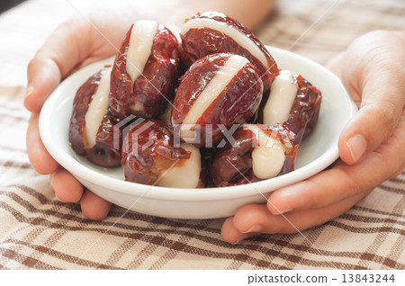 Hand serving chinese dessert. 13843244