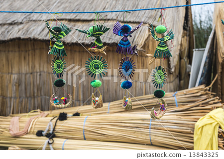 Souvenir from reed on Floating islands Titicaca lake, Peru, Sout 13843325