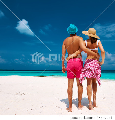 Couple in blue on a beach at Maldives Couple in blue on a beach at Maldives 13847221