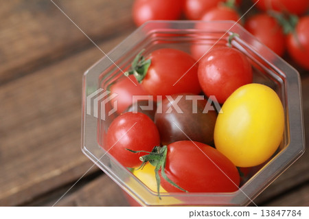 Various kinds of cherry tomatoes in plastic cups Various kinds of cherry tomatoes in plastic cups 13847784