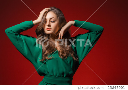 Pretty young girl touching her beautiful hair. Pretty young girl touching her beautiful hair. 13847901