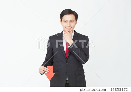 A businessman pointing to an arrow 13853172