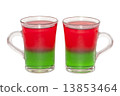 Photo of two transparent glass cups with layered jelly cocktail 13853464