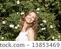 Photo of blonde girl with bright sincere smile standing near bri 13853469