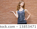 Photo of blonde girl thinking over the choice 13853471