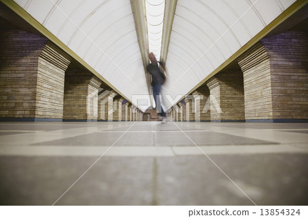 Blurred man on subway platform Blurred man on subway platform 13854324