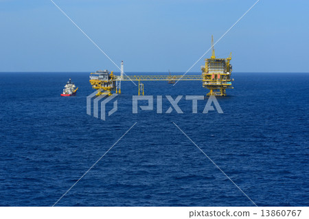 The offshore oil rig and supply boat The offshore oil rig and supply boat 13860767