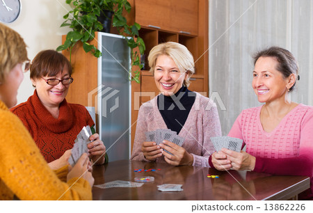 Women having fun with cards Women having fun with cards 13862226