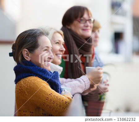 Female having tea on terrace 13862232