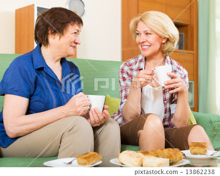 Elderly women at the table with tea Elderly women at the table with tea 13862238