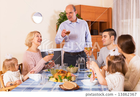 Family at the dining table Family at the dining table 13862367