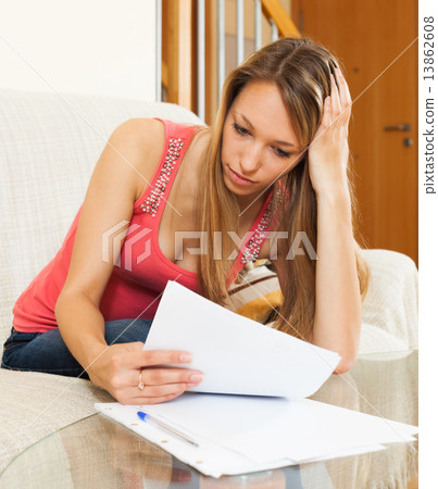 Woman working with papers Woman working with papers 13862608