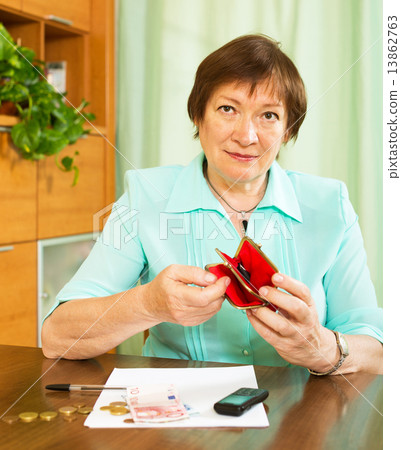 Senior woman with purse in home 13862763