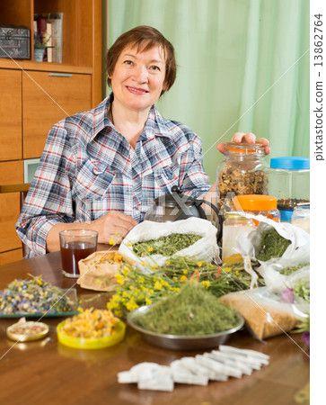 mature woman with medicinal herbs 13862764