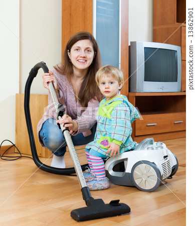 Mother with child cleaning home Mother with child cleaning home 13862901