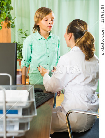 Doctor with teenage boy patient Doctor with teenage boy patient 13863183