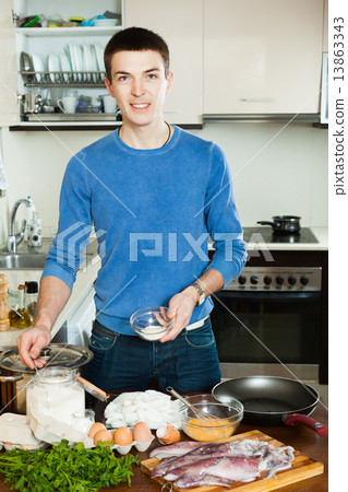 boy cooking calamari boy cooking calamari 13863343