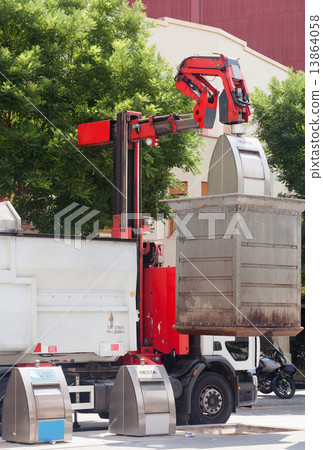 Recycling truck picking up  cans 13864058