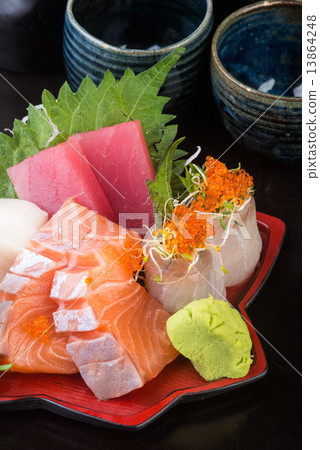 japanese cuisine. sashimi on the background japanese cuisine. sashimi on the background 13864248