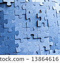 Real photograph of the backside of blue puzzle jigsaw in available light 13864616