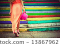 Woman on the colored background 13867962
