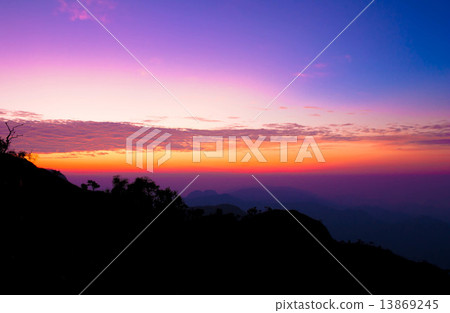 Hills and bright sky during sunrise 13869245