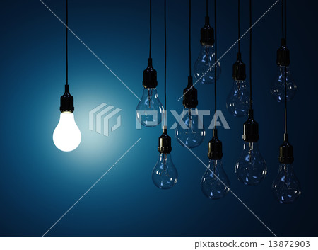 Hanging light bulbs with glowing one isolated on dark blue backg 13872903