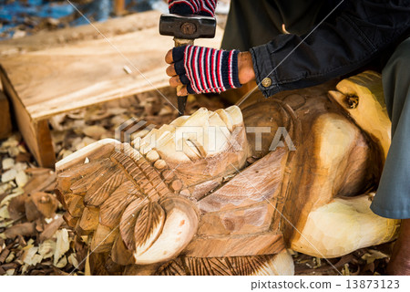 Traditional craftsman carving wood Traditional craftsman carving wood 13873123