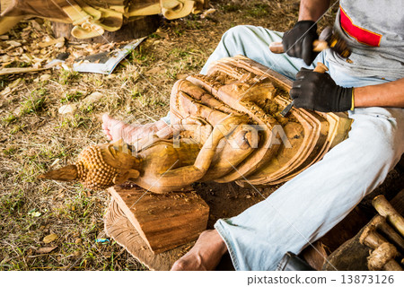 Traditional craftsman carving wood 13873126