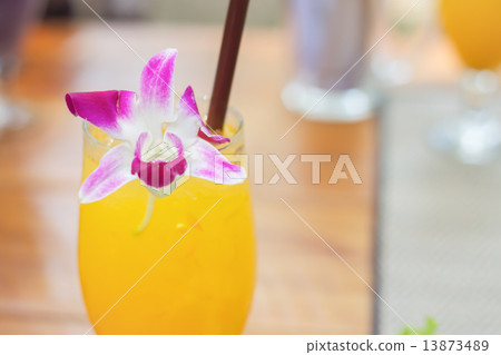 Glass of iced orange juice 13873489