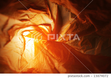 Abstract background of the insides of an orange plastic bag with different color shades Abstract background of the insides of an orange plastic bag with different color shades 13874072