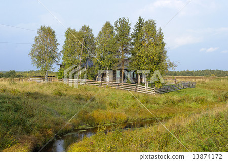 Detached old house with wooden fence in the village Detached old house with wooden fence in the village 13874172