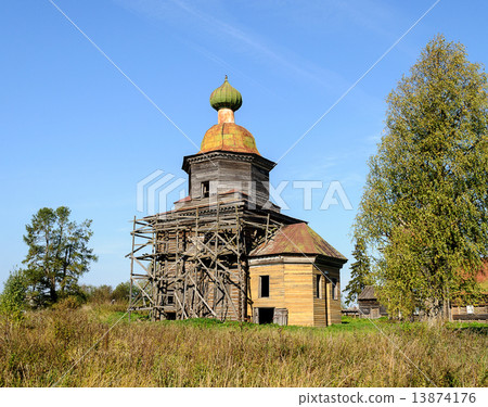 Restored antique wooden church in North Russia near Kargopol 13874176