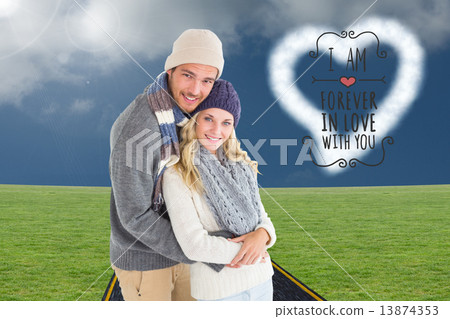 Composite image of attractive couple in winter fashion hugging Composite image of attractive couple in winter fashion hugging 13874353