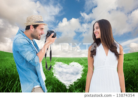Composite image of handsome hipster taking a photo of pretty gir Composite image of handsome hipster taking a photo of pretty gir 13874354