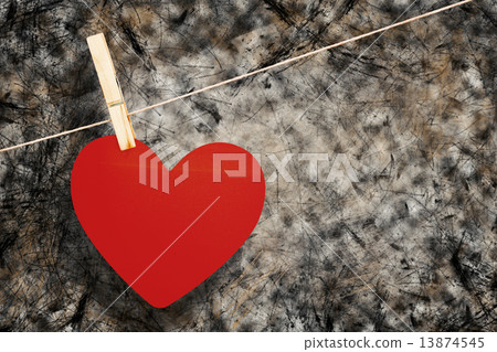 Composite image of heart hanging on line 13874545