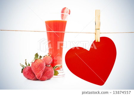 Composite image of heart hanging on line 13874557